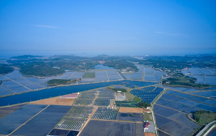 Aerial photo of rice fields and solar farms